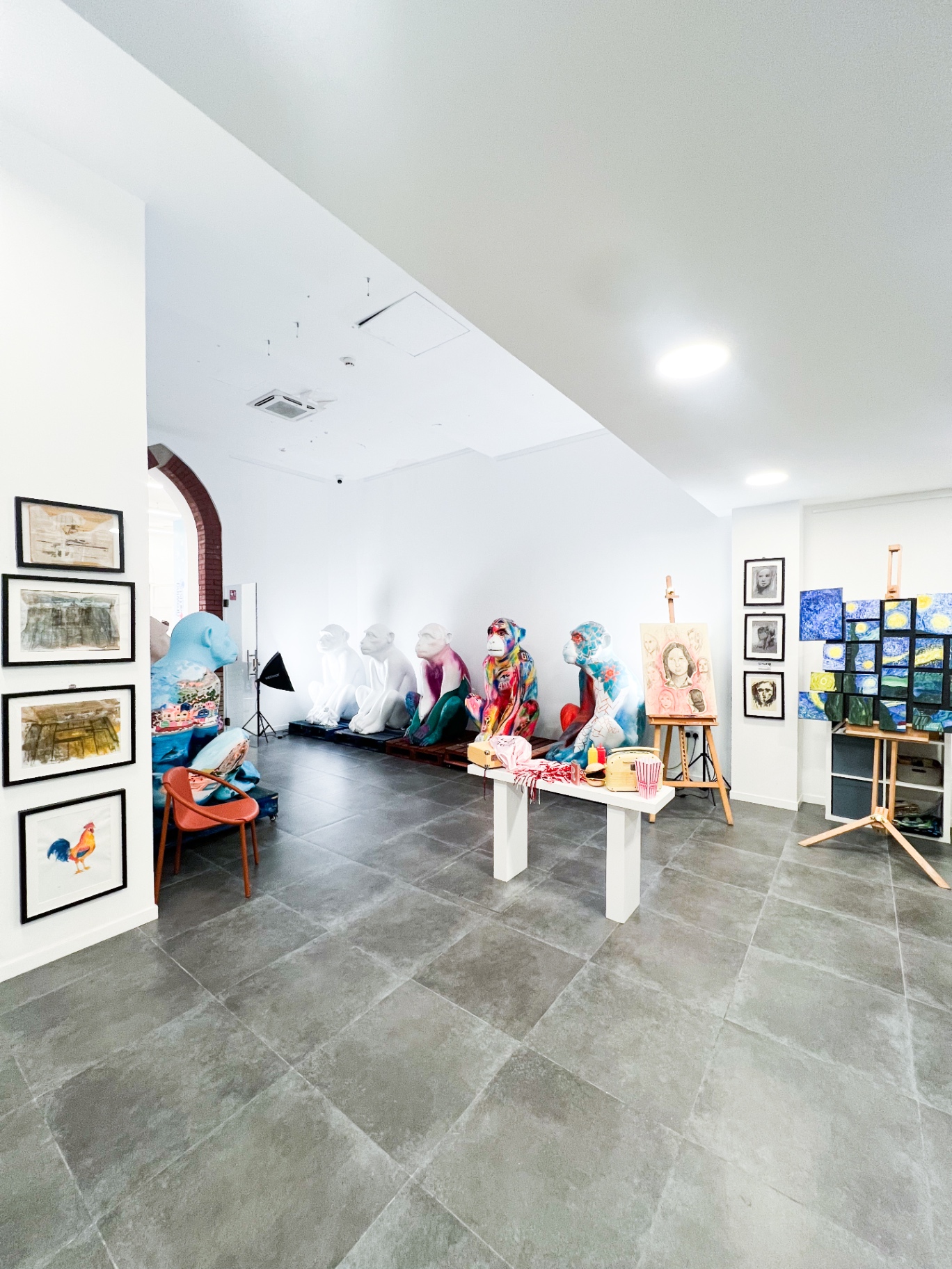 Colourful painted Barbary macaque sculptures lined up in the hub's main space