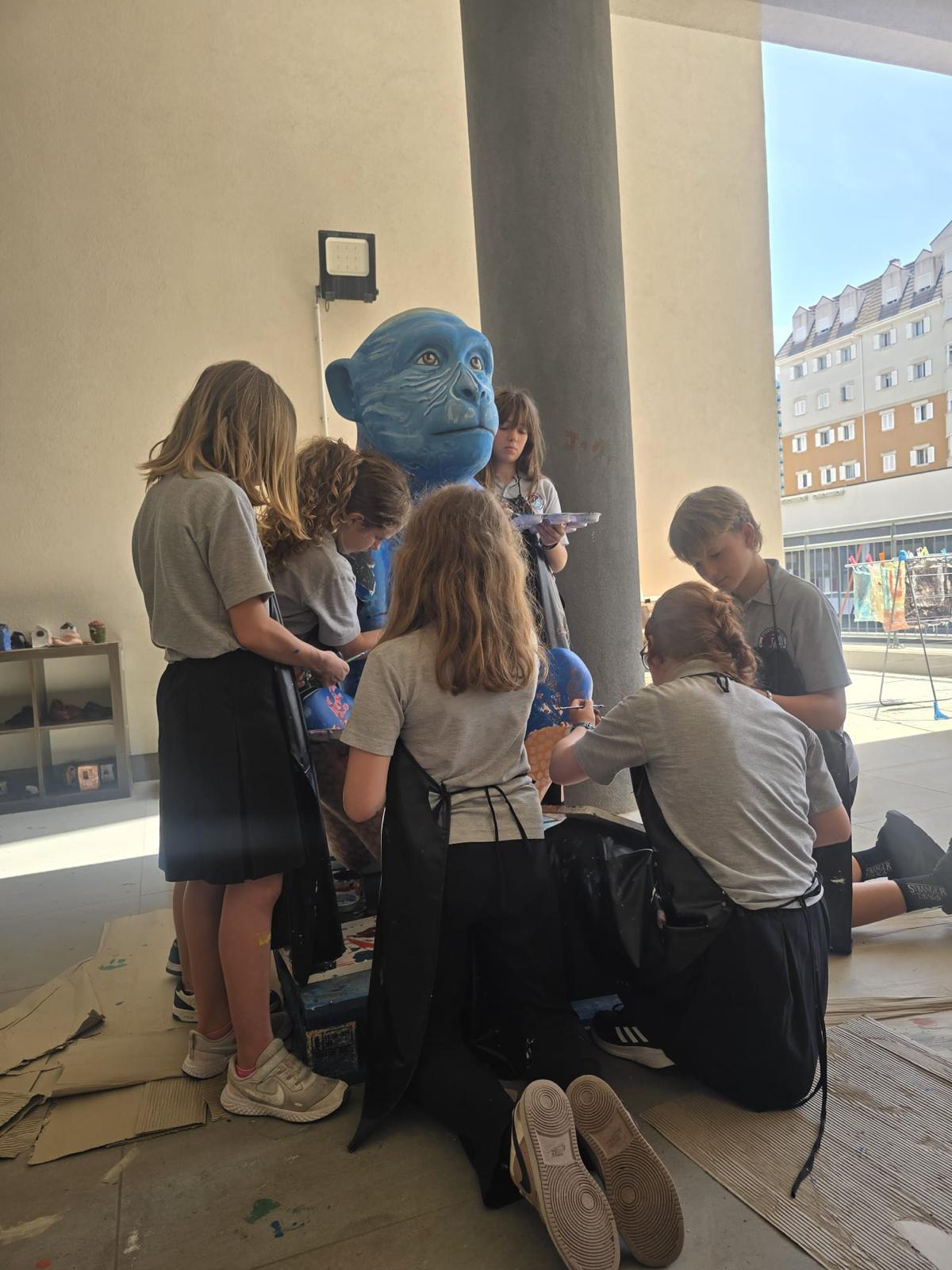 Students starting to sketch and block in early paint on Captain Paul